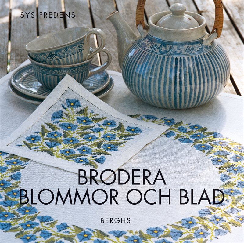 Brodera blommor och blad